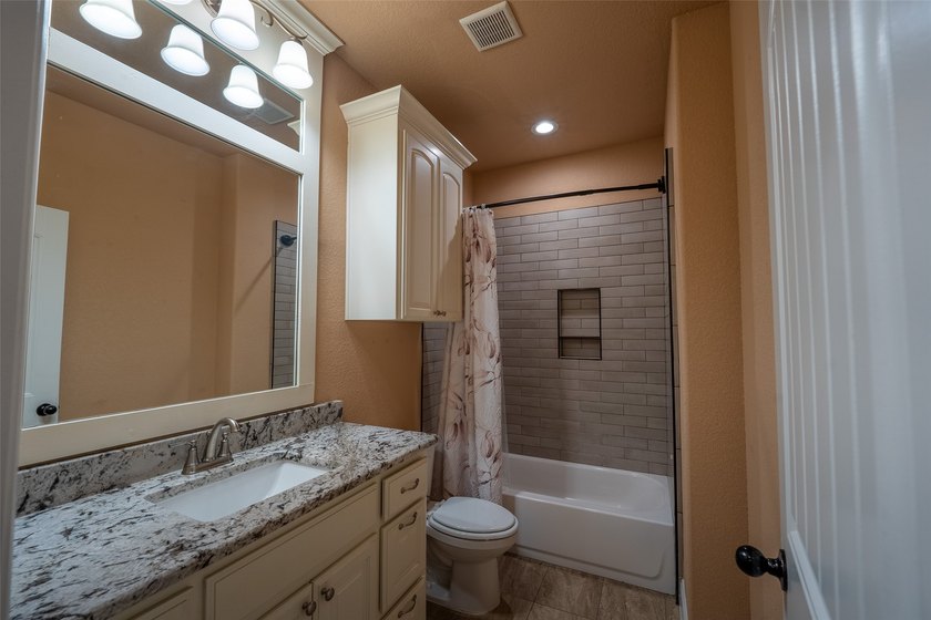 Welcome home to this charming retreat tucked into an established - photo 20