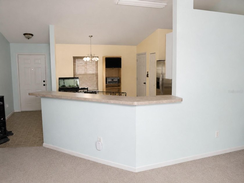 Welcome to Silver Springs Shores! This inviting 3-bedroom - photo 3