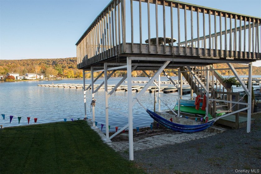 Live the lake life and generate rental income! This rare - photo 2