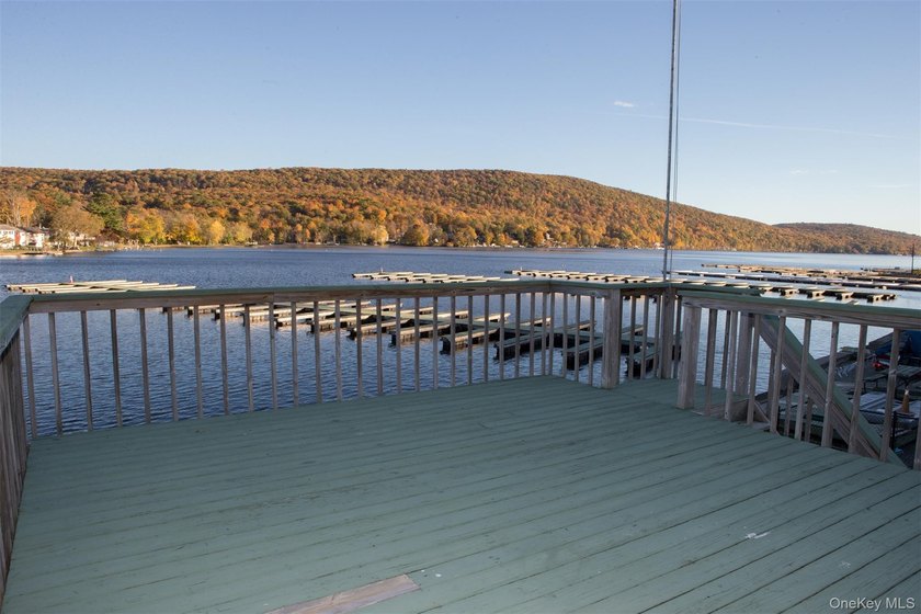 Live the lake life and generate rental income! This rare - photo 3