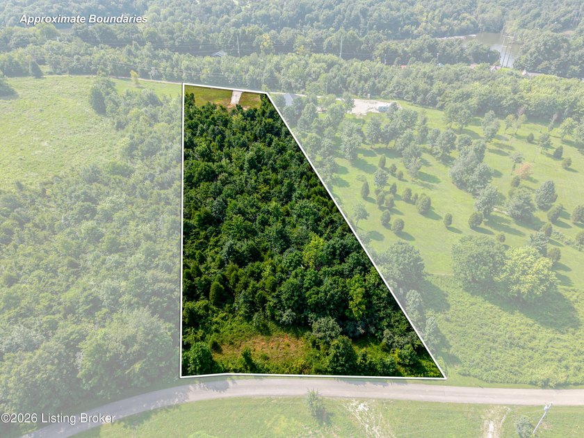 This 1.41-acre wooded lot offers an ideal setting for a - photo 3