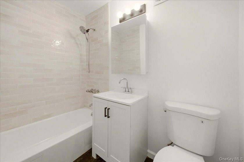 Welcome to this charming two-family Colonial-style duplex in the - photo 17