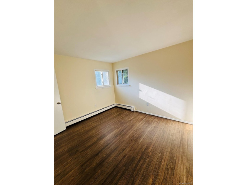 High Ranch With Updated Kitchen And Large Living Room. Hardwood - photo 10