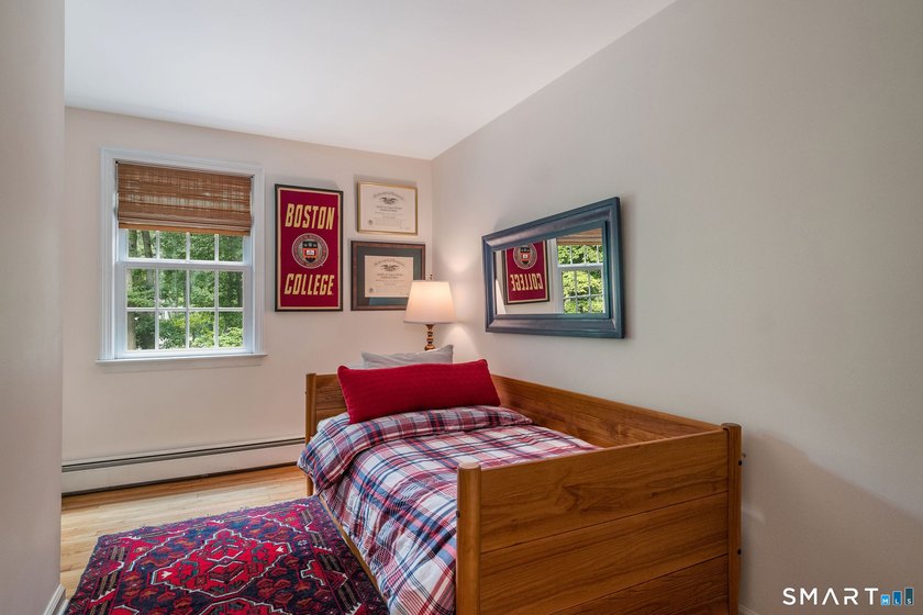 Set gracefully on a beautifully landscaped property framed by - photo 25