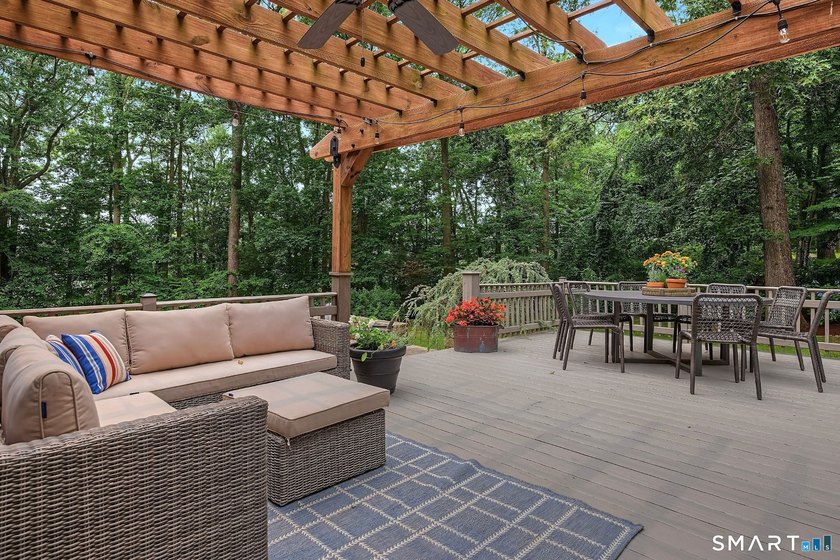 Set gracefully on a beautifully landscaped property framed by - photo 30