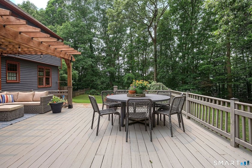 Set gracefully on a beautifully landscaped property framed by - photo 31