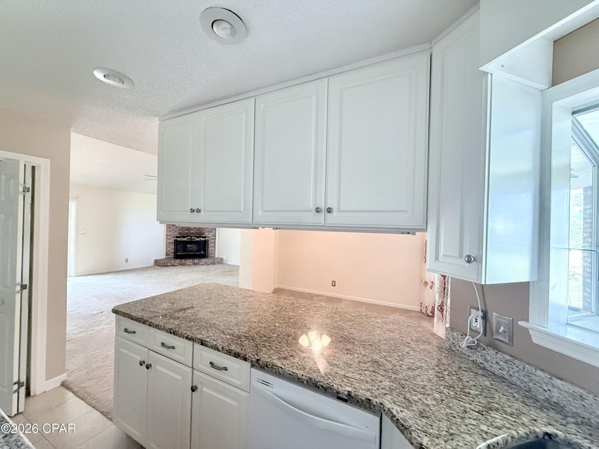 Welcome home to this spacious 3-bedroom, 2-bath brick home - photo 12