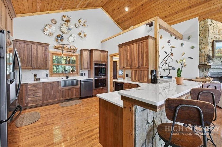 Magnificent home embraced by rhododendrons and hardwood trees - photo 21