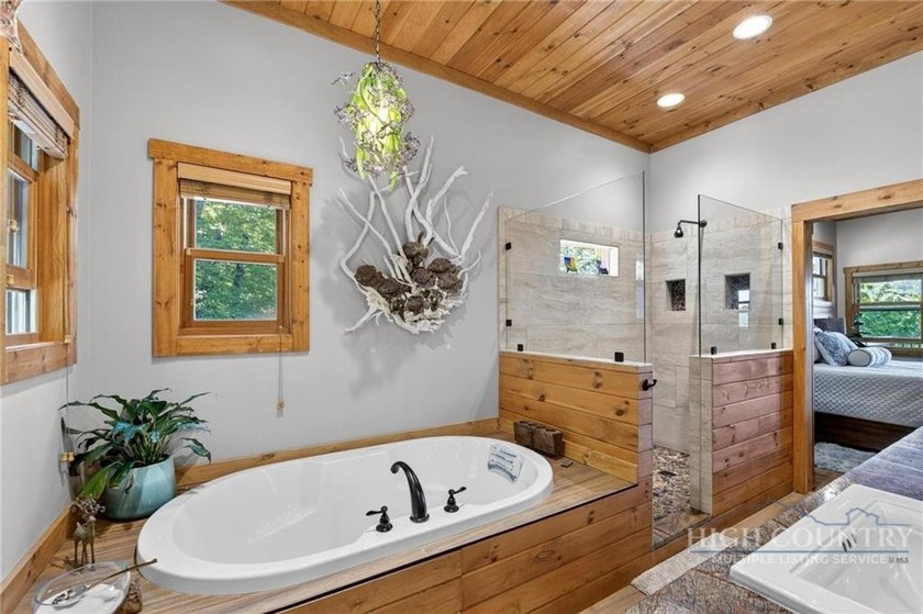 Magnificent home embraced by rhododendrons and hardwood trees - photo 25