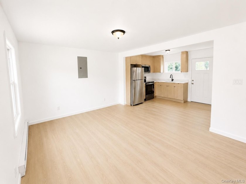 LIVING LUXURY In The Heart Of Bellport! This Ranch Style Home Is - photo 3