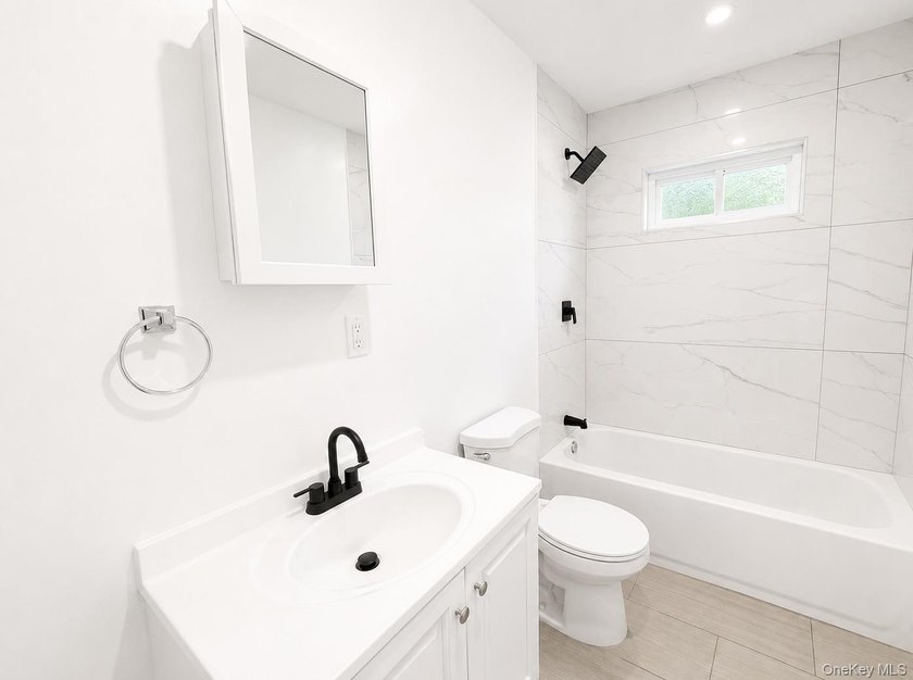 LIVING LUXURY In The Heart Of Bellport! This Ranch Style Home Is - photo 5
