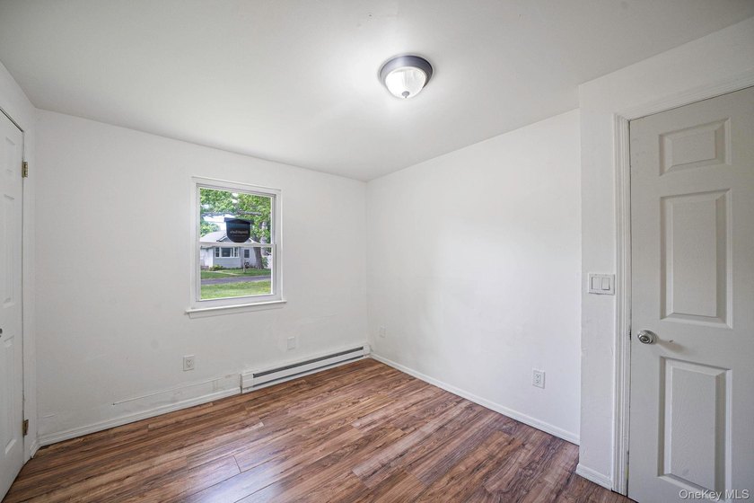 Nestled in the heart of Mastic Beach, 113 Huguenot Drive is the - photo 17