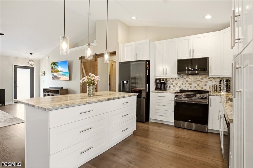 PRICE ADJUSTMENT! Welcome to this beautifully updated 3-bedroom - photo 3
