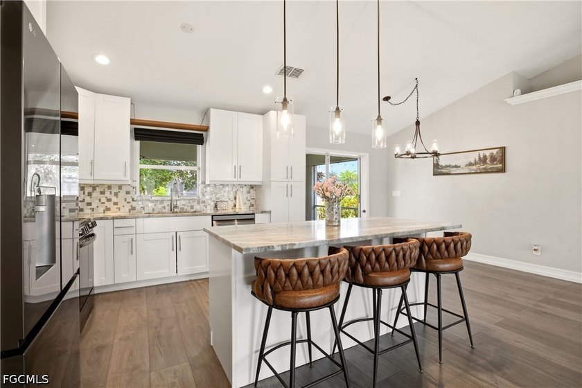 PRICE ADJUSTMENT! Welcome to this beautifully updated 3-bedroom - photo 5