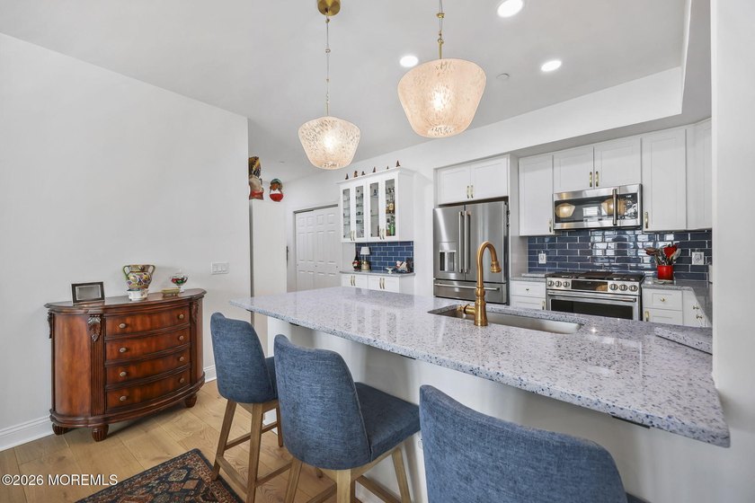 Experience refined coastal living in this lakeview end-unit - photo 12