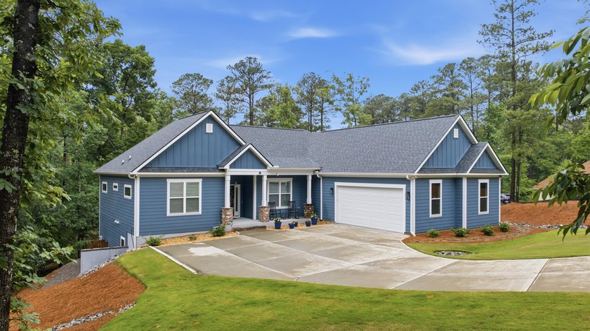 Built just three years ago, this stunning custom lakefront home - photo 2