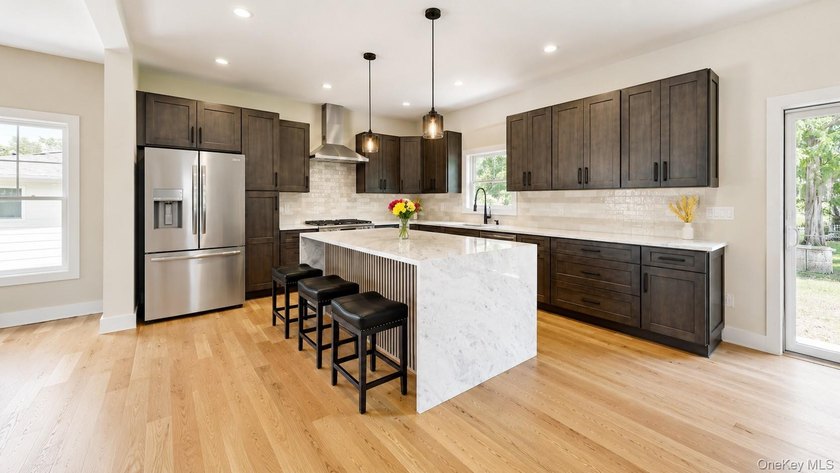 Custom-built Victorian-style home with a charming - photo 7