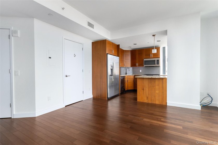 Welcome to Unit 9C at The Aston, a bright and modern high-floor - photo 2