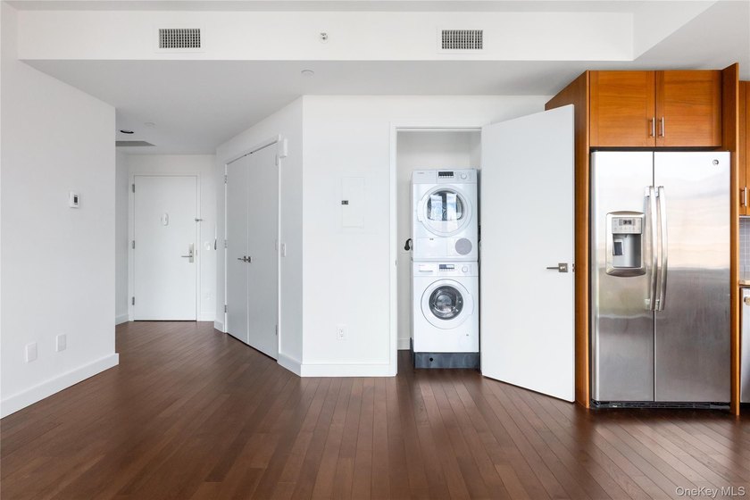 Welcome to Unit 9C at The Aston, a bright and modern high-floor - photo 4