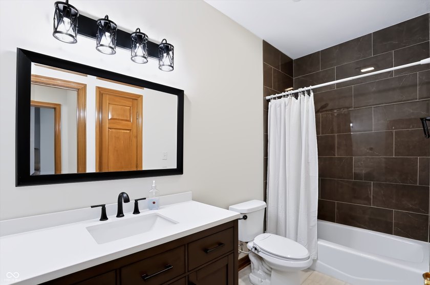 Welcome to this exceptionally well-maintained custom-built - photo 31