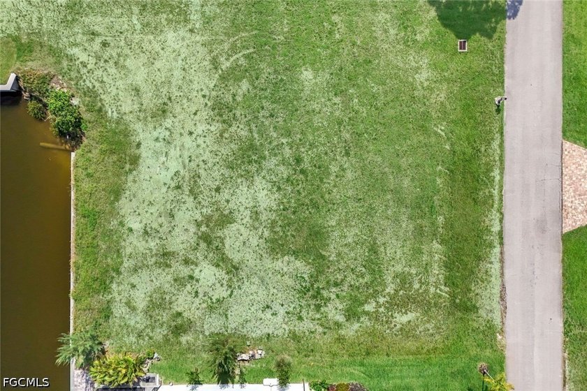 Gulf access, southern exposure, and wide canal views make this - photo 6