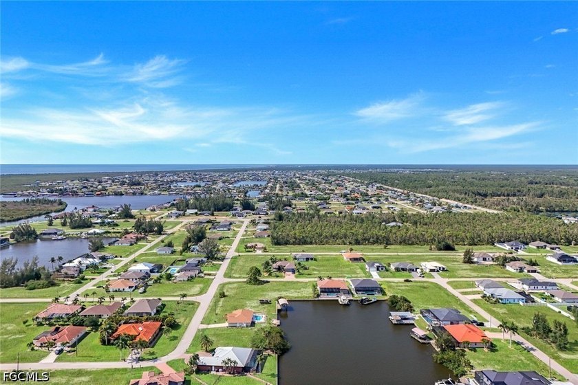 Gulf access, southern exposure, and wide canal views make this - photo 8
