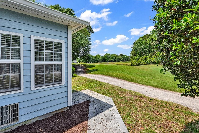Tucked along the manicured fairways of the sought-after Eastport - photo 32