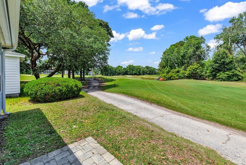 Tucked along the manicured fairways of the sought-after Eastport - photo 35