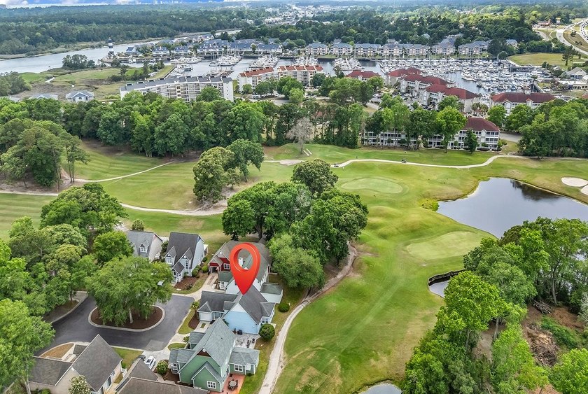Tucked along the manicured fairways of the sought-after Eastport - photo 40