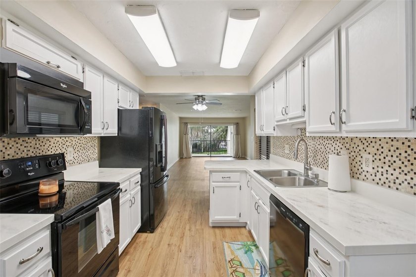 Welcome to this beautifully updated 2-bedroom, 2-bath WATERFRONT - photo 9