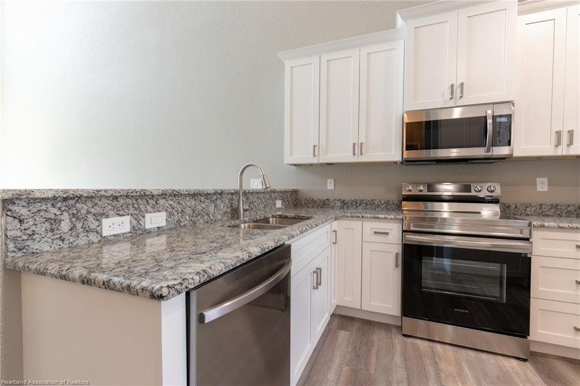 Waterfront townhome development with 3 completed units and over - photo 10