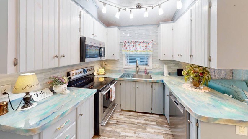 This single-story home is in Reflections On Silver Lake (55+ - photo 16