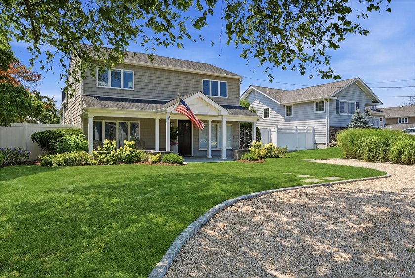 Welcome to this tastefully updated 4-bedroom, 3-bath home in one - photo 2
