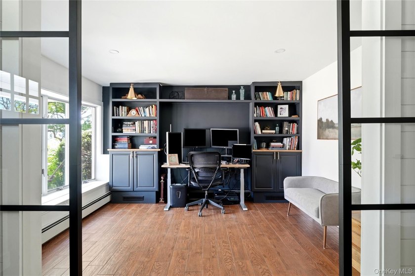 Welcome to this tastefully updated 4-bedroom, 3-bath home in one - photo 6