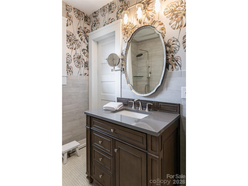 There is a warm, inviting grace to this Grove Park home that - photo 14