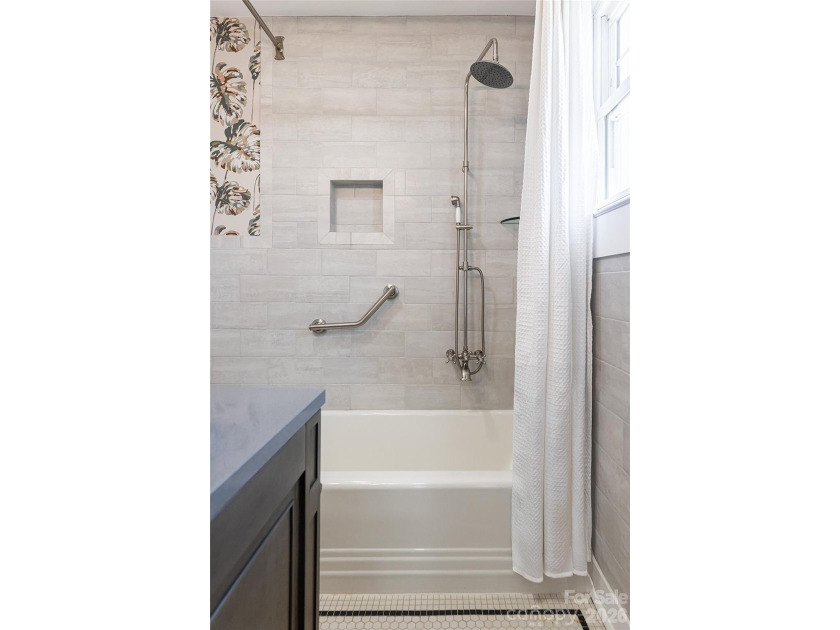 There is a warm, inviting grace to this Grove Park home that - photo 16