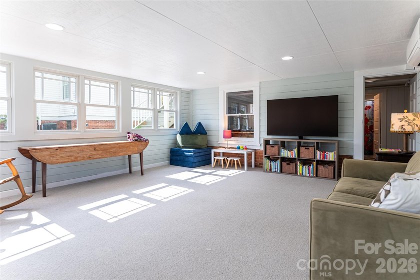 There is a warm, inviting grace to this Grove Park home that - photo 28