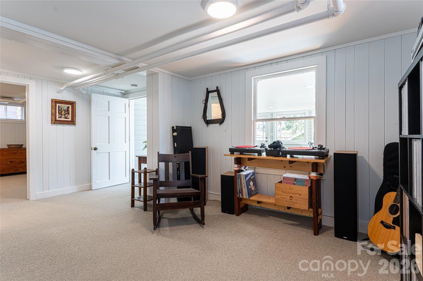There is a warm, inviting grace to this Grove Park home that - photo 31