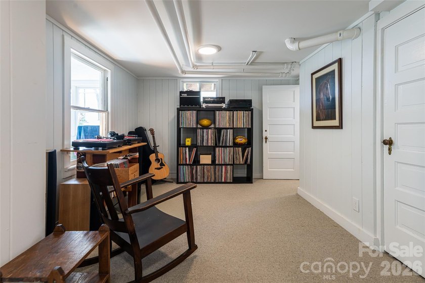 There is a warm, inviting grace to this Grove Park home that - photo 32