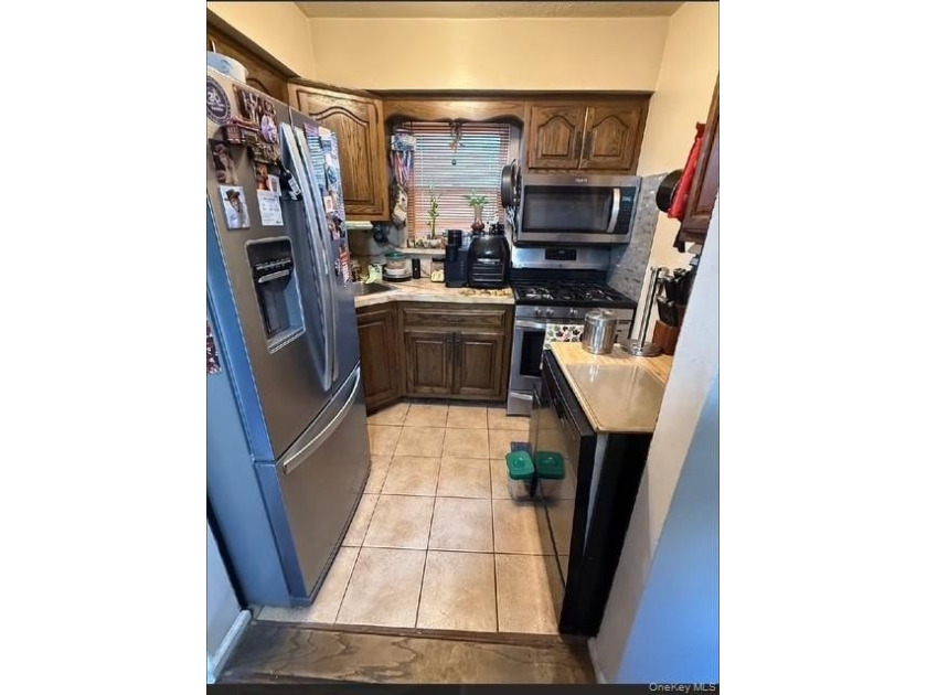 Welcome to this cozy and well-maintained 1-bedroom, 1.5-bathroom - photo 2