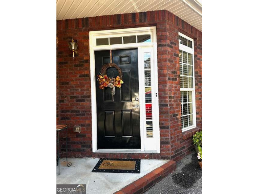 Welcome home to this charming 2-bedroom, 2-bath, all brick condo - photo 2