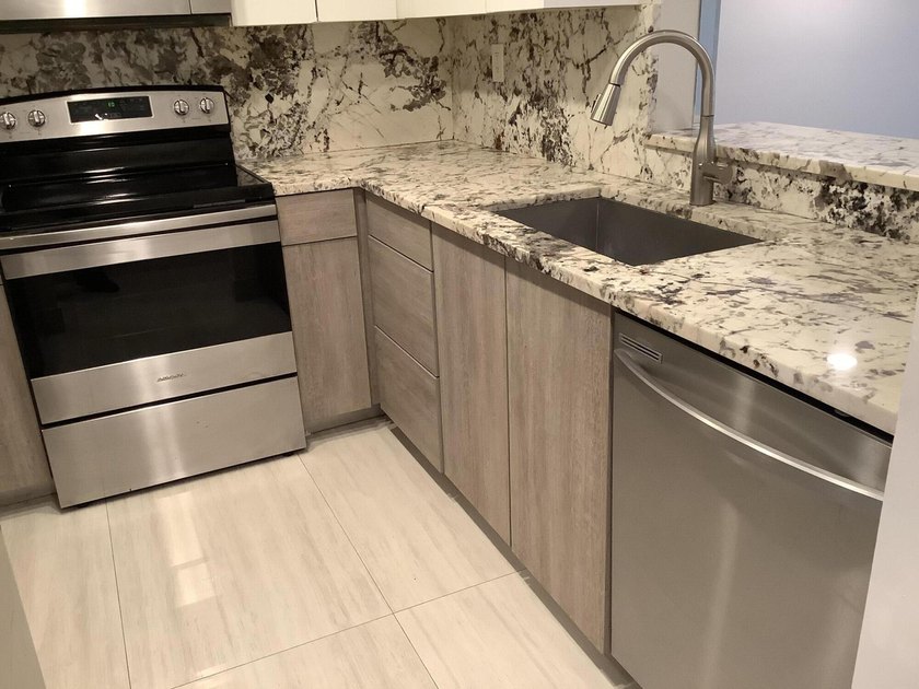 This beautifully renovated 2-bedroom, 2-bathroom townhouse is - photo 3
