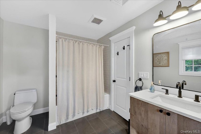 Beautifully Updated Colonial in the Heart of St. James Nestled - photo 19