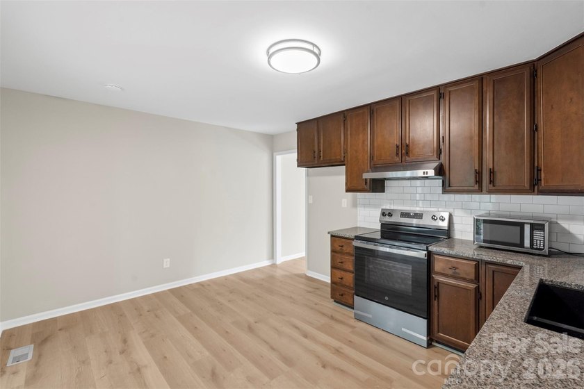 Welcome home to this recently renovated 4-bedroom property - photo 14