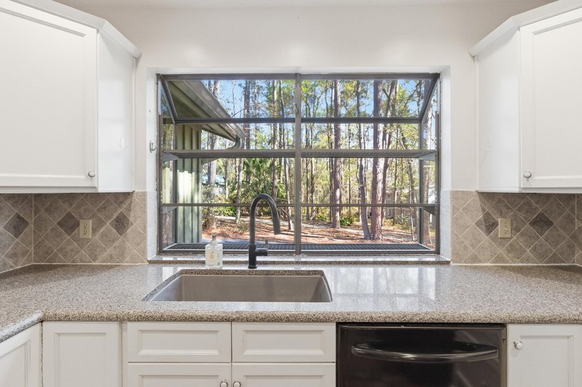 Experience this beautifully updated farmhouse-style home - photo 18