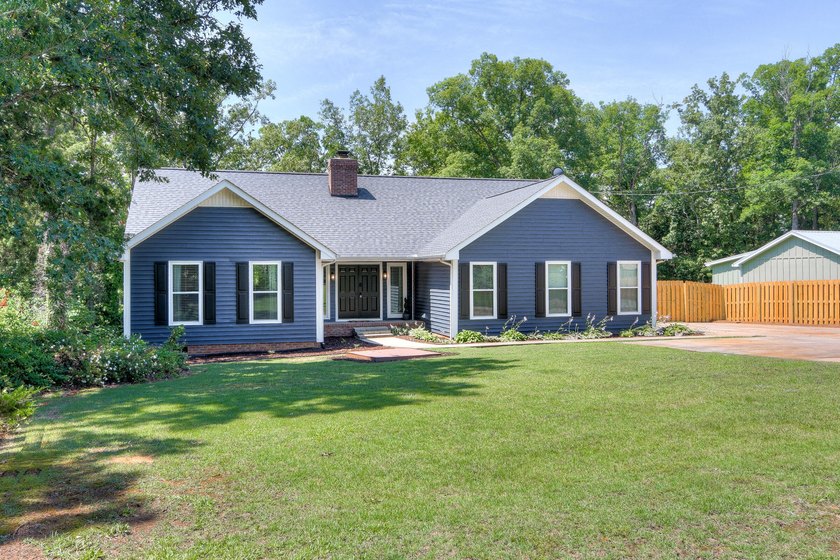 Located just 20 minutes from Evans, this updated Modoc lakehouse - photo 5
