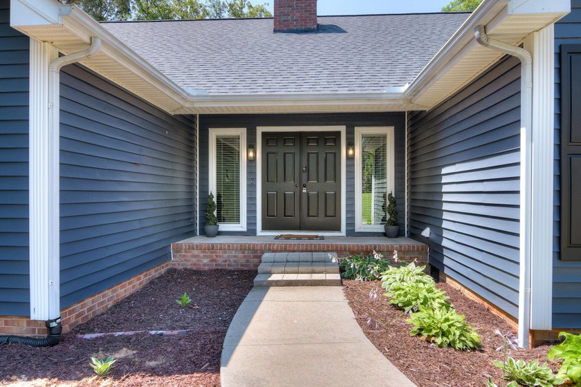 Located just 20 minutes from Evans, this updated Modoc lakehouse - photo 6