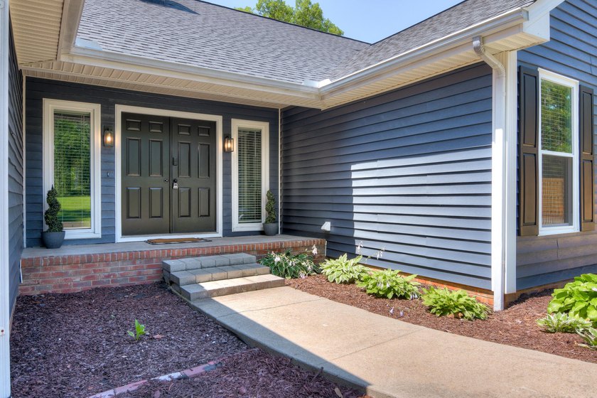 Located just 20 minutes from Evans, this updated Modoc lakehouse - photo 7