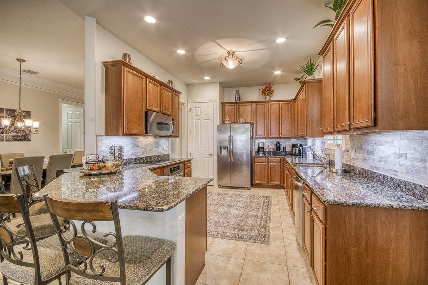 Rarely available single-level villa in Mallory Creek, offering a - photo 10