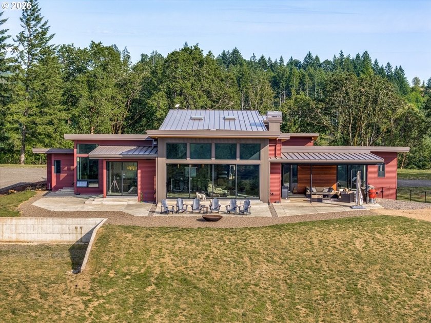 Spectacular modern masterpiece on 124.5 acres. This 2023-built - photo 3